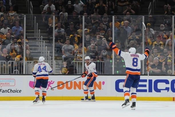 Jean-Gabriel Pageau, Josh Bailey and Noah Dobson of the New York Islanders celebrate the second period goal against the Boston Bruins in Game Five of...