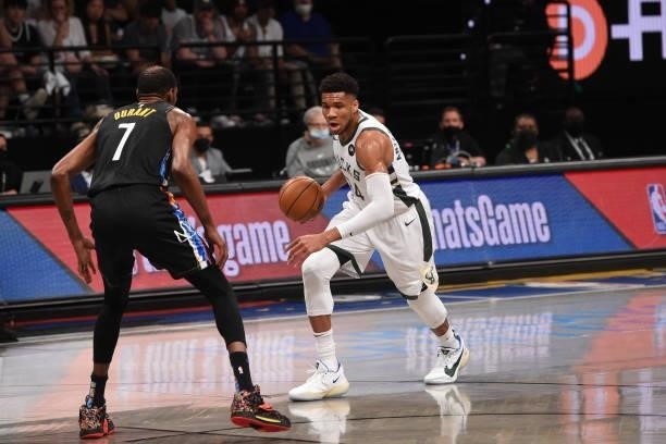 Giannis Antetokounmpo of the Milwaukee Bucks handles the ball against Kevin Durant of the Brooklyn Nets during Round 2, Game 2 on June 7, 2021 at...