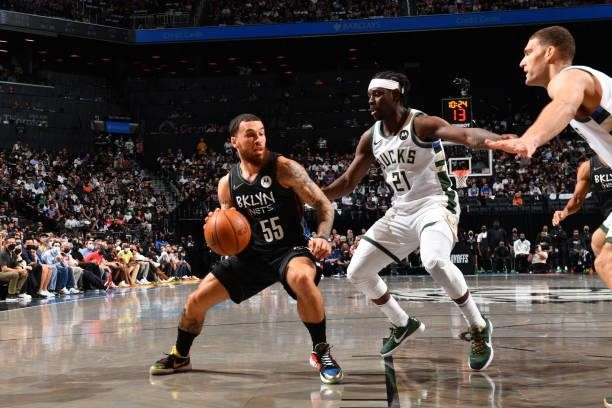 Mike James of the Brooklyn Nets handles the ball against Jrue Holiday of the Milwaukee Bucks during Round 2, Game 2 on June 7, 2021 at Barclays...