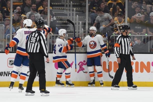 Jean-Gabriel Pageau and Jordan Eberle the New York Islanders fist bump after the goal in the second period against the Boston Bruins in Game Five of...