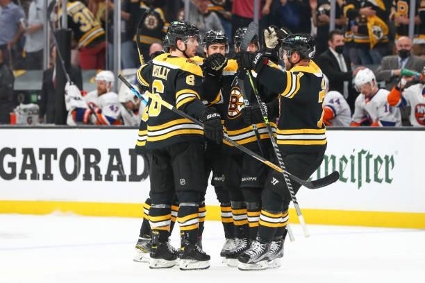 David Krejci of the Boston Bruins celebrates with teammates after scoring in the third period in Game Five of the Second Round of the 2021 Stanley...
