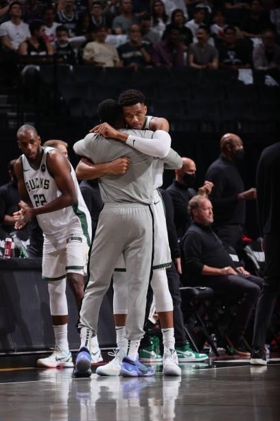 Giannis Antetokounmpo of the Milwaukee Bucks hugs Bobby Portis of the Milwaukee Bucks before the game against the Brooklyn Nets during Round 2, Game...
