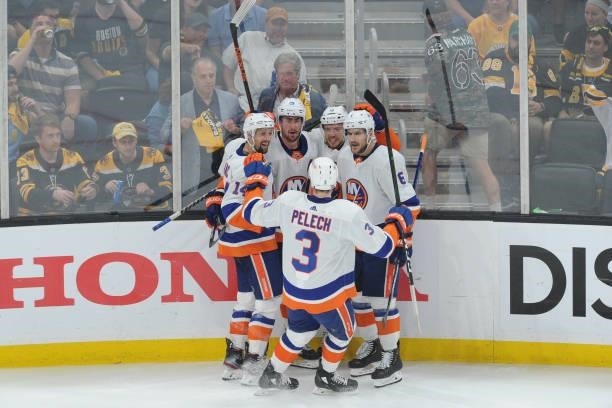 The New York Islanders celebrate the third period goal against the Boston Bruins in Game Five of the Second Round of the 2021 Stanley Cup Playoffs at...