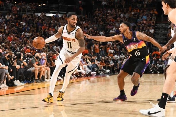 Cameron Payne of the Phoenix Suns plays defense on Monte Morris of the Denver Nuggets during Round 2, Game 1 of the 2021 NBA Playoffs on June 7, 2021...
