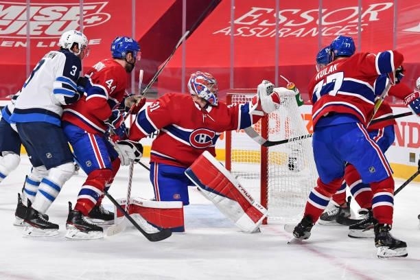 Goaltender Carey Price of the Montreal Canadiens makes a glove save against the Winnipeg Jets during the third period in Game Four of the Second...