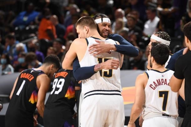 Nikola Jokic hugs JaVale McGee of the Denver Nuggets before the game against the Phoenix Suns during Round 2, Game 1 of the 2021 NBA Playoffs on June...