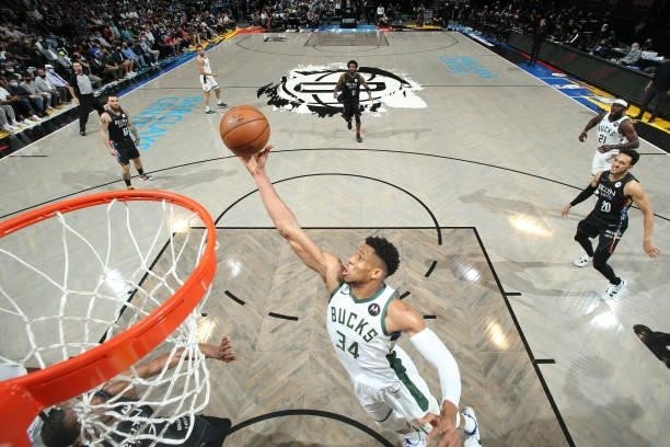 Giannis Antetokounmpo of the Milwaukee Bucks rebounds the ball against the Brooklyn Nets during Round 2, Game 2 of the 2021 NBA Playoffs on June 7,...