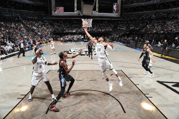 Giannis Antetokounmpo of the Milwaukee Bucks rebounds the ball against the Brooklyn Nets during Round 2, Game 2 of the 2021 NBA Playoffs on June 7,...