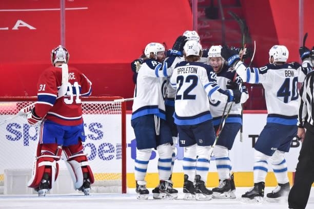 The Winnipeg Jets celebrate a goal by Logan Stanley against the Montreal Canadiens during the second period in Game Four of the Second Round of the...