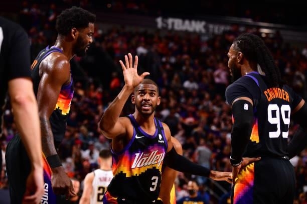 Chris Paul talks to Deandre Ayton and Jae Crowder of the Phoenix Suns during Round 2, Game 1 of the 2021 NBA Playoffs on June 7, 2021 at Phoenix Suns...