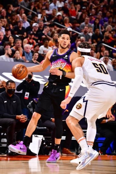 Aaron Gordon of the Denver Nuggets plays defense on Devin Booker of the Phoenix Suns during Round 2, Game 1 of the 2021 NBA Playoffs on June 7, 2021...