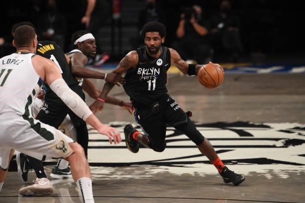 Kyrie Irving of the Brooklyn Nets handles the ball against the Milwaukee Bucks during Round 2, Game 2 on June 7, 2021 at Barclays Center in Brooklyn,...