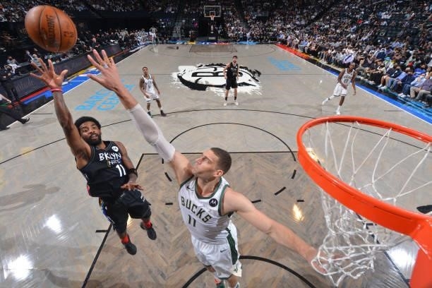 Kyrie Irving of the Brooklyn Nets shoots the ball against the Milwaukee Bucks during Round 2, Game 2 on June 7, 2021 at Barclays Center in Brooklyn,...