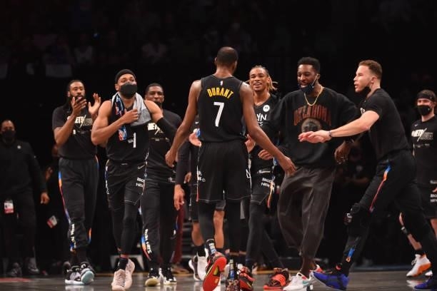 Kevin Durant of the Brooklyn Nets and the Brooklyn Nets react during a game against the Milwaukee Bucks during Round 2, Game 2 on June 7, 2021 at...