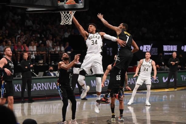 Giannis Antetokounmpo of the Milwaukee Bucks shoots the ball against Kevin Durant of the Brooklyn Nets during Round 2, Game 2 on June 7, 2021 at...