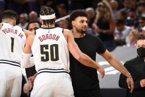 Aaron Gordon of the Denver Nuggets hugs Jamal Murray before the game against the Phoenix Suns during Round 2, Game 1 of the 2021 NBA Playoffs on June...