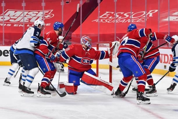 Goaltender Carey Price of the Montreal Canadiens makes a glove save against the Winnipeg Jets during the third period in Game Four of the Second...