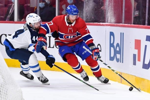 June 7: Brett Kulak of the Montreal Canadiens skates with the puck under pressure from Josh Morrissey of the Winnipeg Jets in Game Four of the Second...