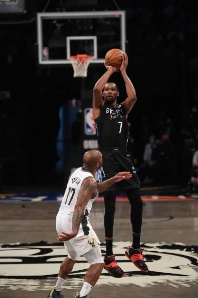 Kevin Durant of the Brooklyn Nets shoots the ball against P.J. Tucker of the Milwaukee Bucks during Round 2, Game 2 on June 7, 2021 at Barclays...