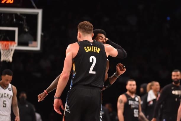 Blake Griffin of the Brooklyn Nets and Kyrie Irving of the Brooklyn Nets react during a game against the Milwaukee Bucks during Round 2, Game 2 on...