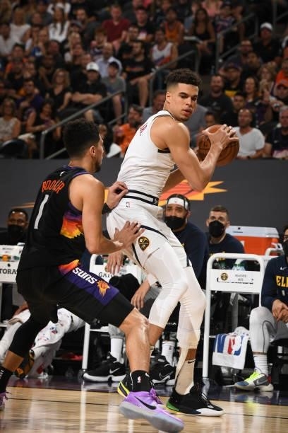 Devin Booker of the Phoenix Suns plays defense on Michael Porter Jr. #1 of the Denver Nuggets during Round 2, Game 1 of the 2021 NBA Playoffs on June...