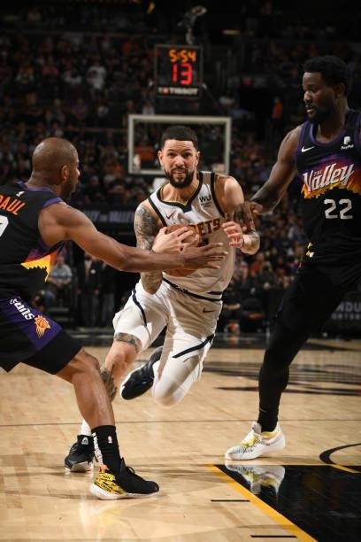 Austin Rivers of the Denver Nuggets drives to the basket during Round 2, Game 1 of the 2021 NBA Playoffs on June 7, 2021 at Phoenix Suns Arena in...