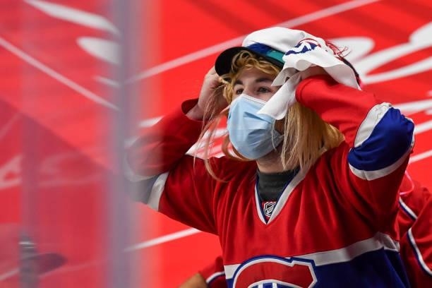 Fan takes in the atmosphere prior to the start of the overtime period between the Montreal Canadiens and the Winnipeg Jets in Game Four of the Second...
