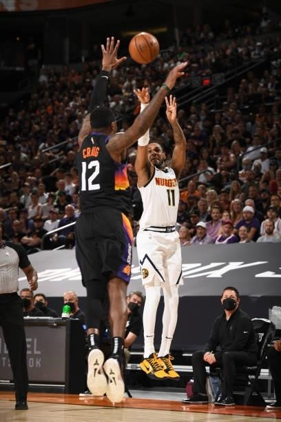 Monte Morris of the Denver Nuggets shoots a three point basket during Round 2, Game 1 of the 2021 NBA Playoffs on June 7, 2021 at Phoenix Suns Arena...