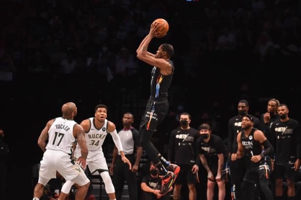 Kevin Durant of the Brooklyn Nets shoots the ball against P.J. Tucker of the Milwaukee Bucks during Round 2, Game 2 on June 7, 2021 at Barclays...