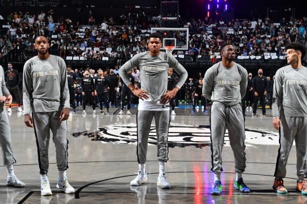 Giannis Antetokounmpo of the Milwaukee Bucks stands during the National Anthem prior to a game against the Brooklyn Nets during Round 2, Game 2 on...