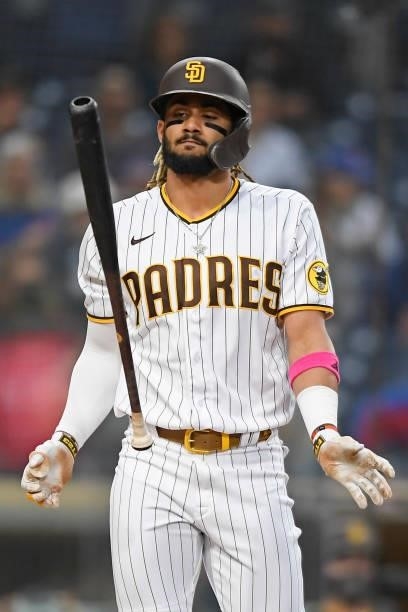 Fernando Tatis Jr. #23 of the San Diego Padres flips his bat after striking out during the first inning of a baseball game against the Chicago Cubs...