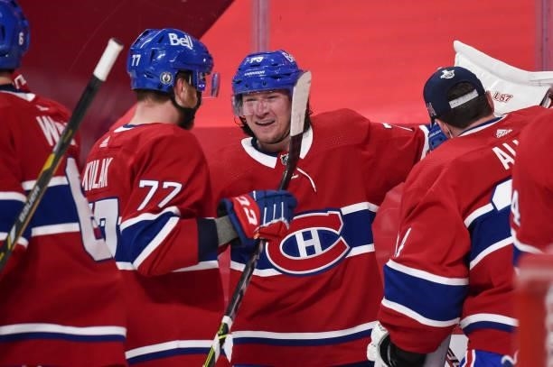 Tyler Toffoli of the Montreal Canadiens celebrates his overtime goal with teammate Brett Kulak against the Winnipeg Jets in Game Four of the Second...