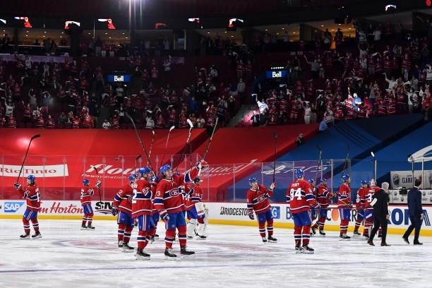 The Montreal Canadiens salute the fans following their 3-2 overtime victory against the Winnipeg Jets to close out the series in Game Four of the...