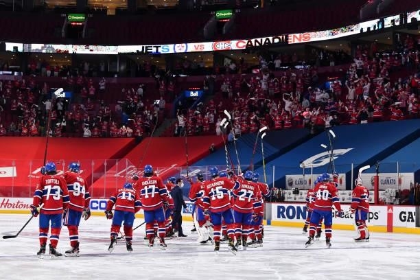 The Montreal Canadiens salute the fans following their 3-2 overtime victory against the Winnipeg Jets to close out the series in Game Four of the...