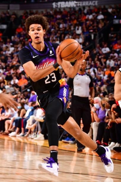 Cameron Johnson of the Phoenix Suns drives to the basket and looks to pass the ball during Round 2, Game 1 of the 2021 NBA Playoffs on June 7, 2021...