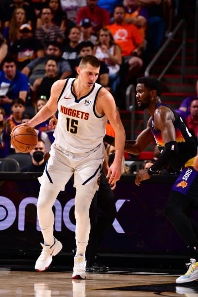 Deandre Ayton of the Phoenix Suns plays defense on Nikola Jokic of the Denver Nuggets during Round 2, Game 1 of the 2021 NBA Playoffs on June 7, 2021...