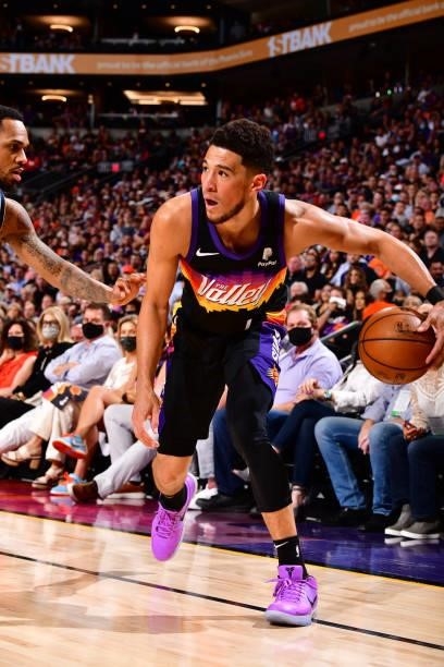 Devin Booker of the Phoenix Suns dribbles the ball against the Denver Nuggets during Round 2, Game 1 of the 2021 NBA Playoffs on June 7, 2021 at...