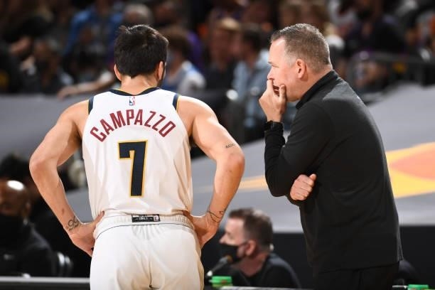 Head Coach Michael Malone of the Denver Nuggets talks with Facundo Campazzo during Round 2, Game 1 of the 2021 NBA Playoffs on June 7, 2021 at...