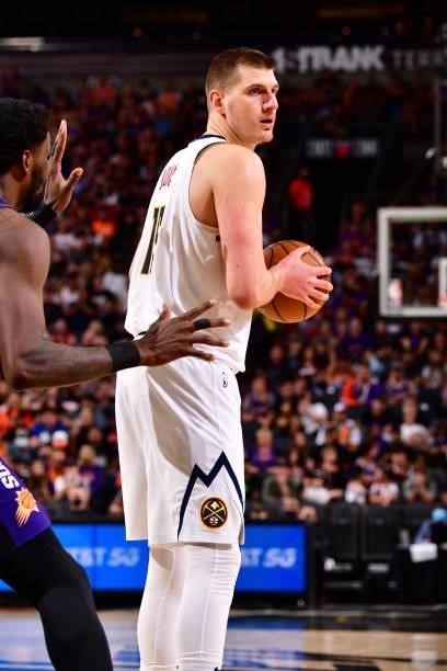 Nikola Jokic of the Denver Nuggets looks to pass the ball against the Phoenix Suns during Round 2, Game 1 of the 2021 NBA Playoffs on June 7, 2021 at...