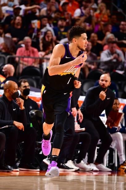 Devin Booker of the Phoenix Suns celebrates a three point basket against the Denver Nuggets during Round 2, Game 1 of the 2021 NBA Playoffs on June...