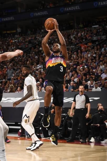 Chris Paul of the Phoenix Suns shoots the ball against the Denver Nuggets during Round 2, Game 1 of the 2021 NBA Playoffs on June 7, 2021 at Phoenix...