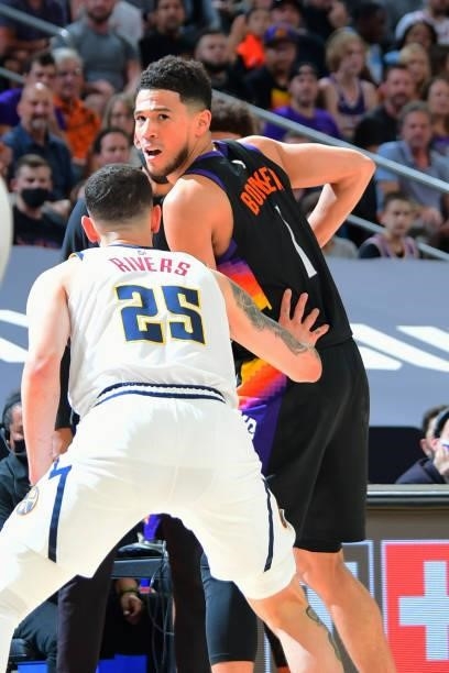 Devin Booker of the Phoenix Suns handles the ball during the game against the Denver Nuggets during Round 2, Game 1 of the 2021 NBA Playoffs on June...