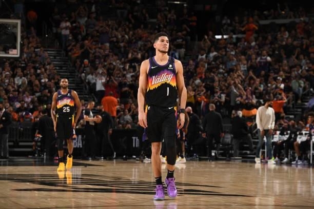 Devin Booker of the Phoenix Suns looks on during Round 2, Game 1 of the 2021 NBA Playoffs on June 7, 2021 at Phoenix Suns Arena in Phoenix, Arizona....