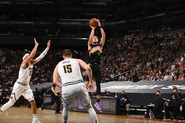 Devin Booker of the Phoenix Suns shoots the ball against the Denver Nuggets during Round 2, Game 1 of the 2021 NBA Playoffs on June 7, 2021 at...