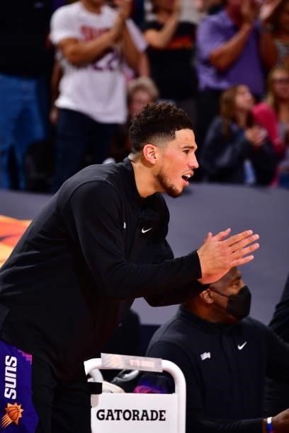 Devin Booker of the Phoenix Suns celebrates against the Denver Nuggets during Round 2, Game 1 of the 2021 NBA Playoffs on June 7, 2021 at Phoenix...