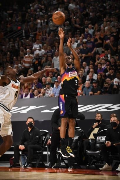 Chris Paul of the Phoenix Suns shoots a three point basket during Round 2, Game 1 of the 2021 NBA Playoffs on June 7, 2021 at Phoenix Suns Arena in...