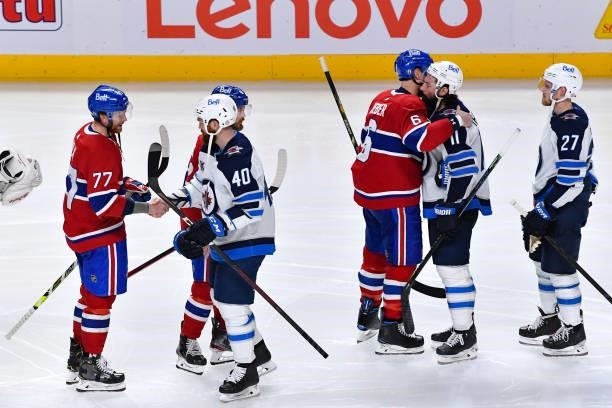 June 7: Montreal Canadiens players shake hands with the Winnipeg Jets player after the Montreal Canadiens victory in Game Four of the Second Round of...