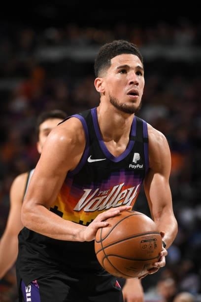 Devin Booker of the Phoenix Suns shoots a free throw during Round 2, Game 1 of the 2021 NBA Playoffs on June 7, 2021 at Phoenix Suns Arena in...
