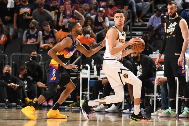Mikal Bridges of the Phoenix Suns plays defense on Michael Porter Jr. #1 of the Denver Nuggets during Round 2, Game 1 of the 2021 NBA Playoffs on...