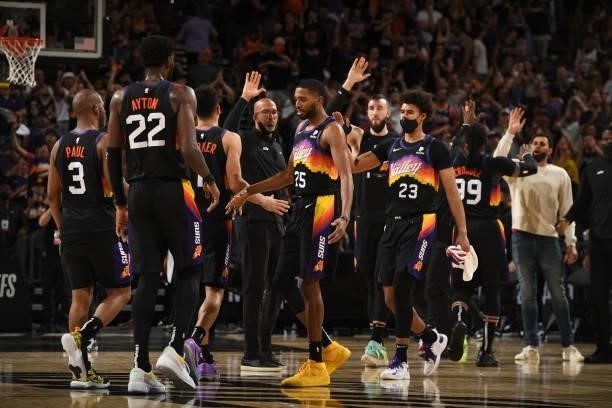 The Phoenix Suns hi-five during Round 2, Game 1 of the 2021 NBA Playoffs on June 7, 2021 at Phoenix Suns Arena in Phoenix, Arizona. NOTE TO USER:...